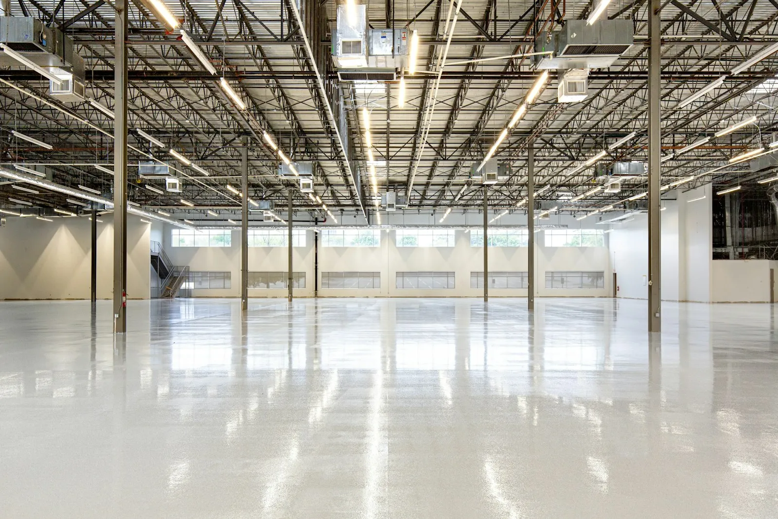 A large commercial hard floor with a polished finish
