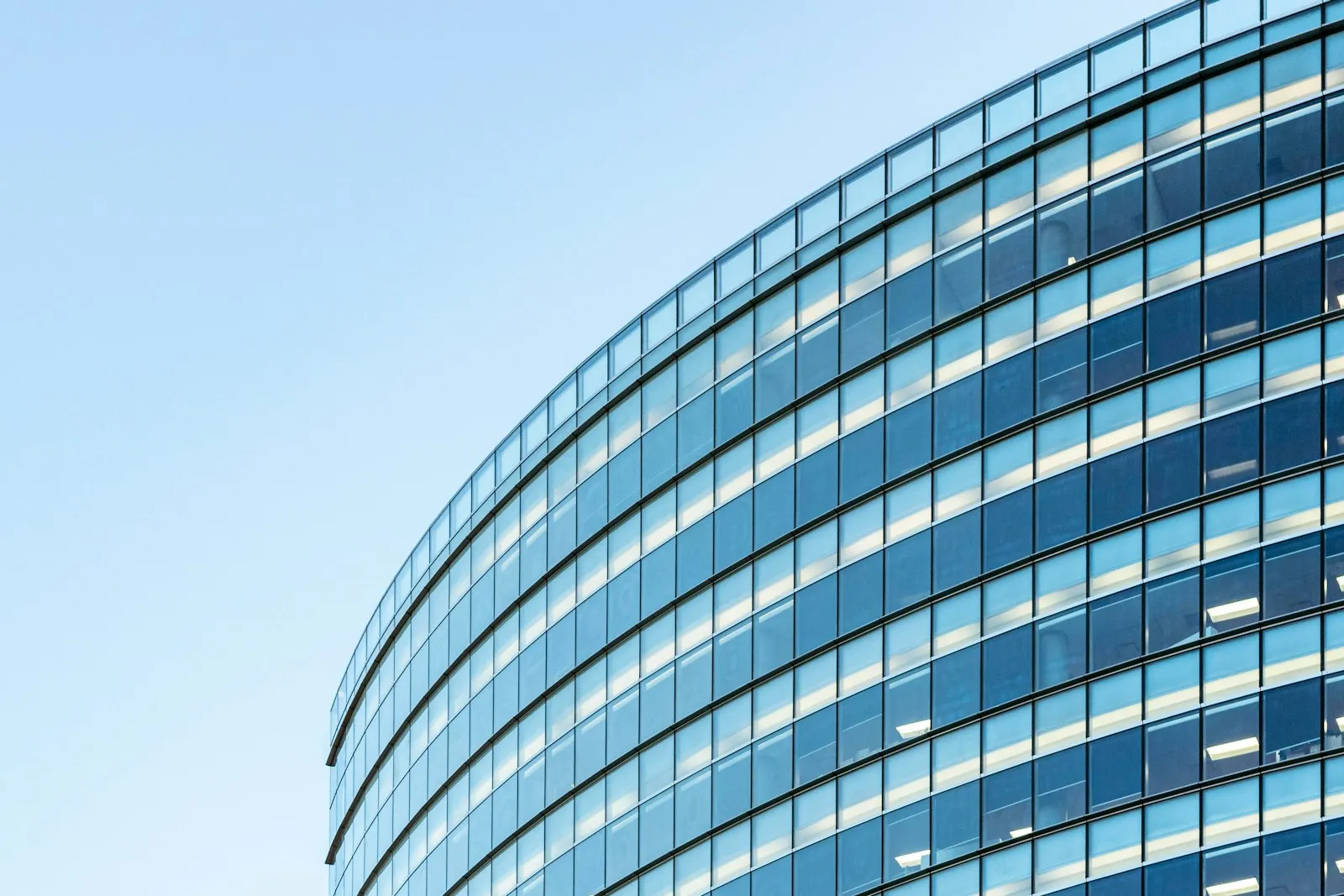 The glass facade of a commercial office building